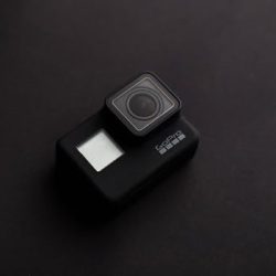 High-quality image of a GoPro camera on a dark surface, ideal for tech content.